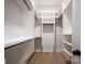 Spacious walk-in closet with custom shelving and hanging rods offers ample storage space at 3020 Georgia Ave, Charlotte, NC 28205