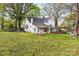 Large yard with a covered outdoor space perfect for entertaining and enjoying the outdoors at 310 N Central Ave, Landis, NC 28088