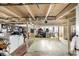 Unfinished basement providing ample storage or potential for customization with laundry area and windows at 310 N Central Ave, Landis, NC 28088