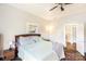 Bright bedroom with wooden floors, shiplap walls, ceiling fan and natural light from a window at 310 N Central Ave, Landis, NC 28088