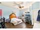 Comfortable bedroom featuring a cozy bed, ceiling fan, and ample natural light from the window at 310 N Central Ave, Landis, NC 28088