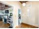 Inviting hallway showcasing hardwood floors, neutral paint, and access to multiple rooms of the home at 310 N Central Ave, Landis, NC 28088