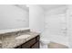 Well-lit bathroom with granite countertop and a shower-tub combo in a modern-styled home at 314 Contentment Dr # 192B, Locust, NC 28097