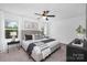 Serene bedroom featuring a large bed, stylish decor, and a ceiling fan for added comfort at 314 Contentment Dr # 192B, Locust, NC 28097
