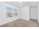 Unfurnished bedroom with wall to wall carpet and natural light, perfect for customization and personal touches at 314 Contentment Dr # 192B, Locust, NC 28097