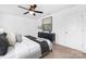 Cozy bedroom with plush bedding, decorative pillows, and a stylish accent cabinet against a neutral backdrop at 314 Contentment Dr # 192B, Locust, NC 28097