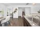 Open-concept living space showcasing a granite countertop, staircase and views of the light-filled living room at 314 Contentment Dr # 192B, Locust, NC 28097