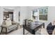Inviting office space featuring a sleek black desk, comfortable seating, and ample natural light from the window at 314 Contentment Dr # 192B, Locust, NC 28097