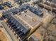 Aerial view of the newly built Caldwell Park neighborhood featuring rows of townhomes and a central parking area at 336 B Lincoln St, Concord, NC 28025