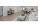 Spacious open-concept living area with modern furnishings and light wood flooring throughout at 336 F Lincoln St, Concord, NC 28025