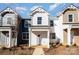 New construction townhome featuring a classic exterior with white siding and a covered front porch at 344 F Lincoln St, Concord, NC 28025