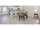 Modern kitchen with white cabinets, stainless steel appliances, quartz countertops, and a breakfast bar at 344 F Lincoln St, Concord, NC 28025