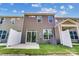 The home's backyard features a small patio and green grass, perfect for enjoying outdoor living at 4217 Black Ct # 194, Harrisburg, NC 28075