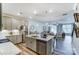 Open-concept kitchen with stainless steel appliances, granite countertops, and an island with seating at 4217 Black Ct # 194, Harrisburg, NC 28075