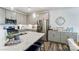 Well-lit kitchen with stainless steel appliances, an island with seating, and granite countertops at 4217 Black Ct # 194, Harrisburg, NC 28075