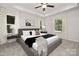 Serene main bedroom with tray ceiling, soft lighting, and large windows at 4217 Whispering Oaks Dr, Charlotte, NC 28213