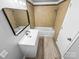 Neutral bathroom featuring single sink vanity, framed mirror, and tiled shower-tub at 4814 Spring Lake Dr # B, Charlotte, NC 28212
