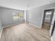 Bedroom featuring hardwood floors and a window at 4814 Spring Lake Dr # B, Charlotte, NC 28212