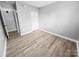 Cozy bedroom featuring hard wood floors, a closet, and fresh paint at 4814 Spring Lake Dr # B, Charlotte, NC 28212