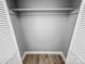 Empty closet featuring hardwood floors and shelving at 4814 Spring Lake Dr # B, Charlotte, NC 28212