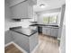 Compact, functional kitchen design, with modern faucet and sink, neutral color cabinets and countertops at 4814 Spring Lake Dr # B, Charlotte, NC 28212