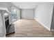 Living room featuring a fireplace and access to the backyard through sliding glass doors at 4814 Spring Lake Dr # B, Charlotte, NC 28212