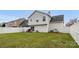 Large grassy backyard featuring a privacy fence, an outdoor dining set, and ample space at 4917 Spruce Peak Rd, Charlotte, NC 28278