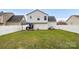 Fenced backyard featuring a grassy lawn and outdoor dining set at 4917 Spruce Peak Rd, Charlotte, NC 28278