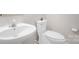 Bright bathroom featuring a white sink, toilet, and neutral wall color creating a clean and modern aesthetic at 4917 Spruce Peak Rd, Charlotte, NC 28278