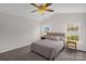 Cozy bedroom with natural light, neutral-toned walls, carpeted floor, and a comfortable bed at 4917 Spruce Peak Rd, Charlotte, NC 28278