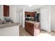 Functional kitchen with stainless steel sink, central island, modern appliances, and ample cabinet space at 4917 Spruce Peak Rd, Charlotte, NC 28278