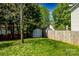 Backyard featuring a well-maintained lawn, privacy fence and storage shed at 513 Buttercup Way, Fort Mill, SC 29715