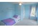 Light blue bedroom with a single bed and ample natural light from two windows at 513 Buttercup Way, Fort Mill, SC 29715