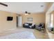 Bright, airy bedroom with ceiling fan and sitting area at 513 Buttercup Way, Fort Mill, SC 29715