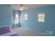 Cozy blue bedroom with natural light from the large windows at 513 Buttercup Way, Fort Mill, SC 29715
