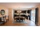 Open dining room with dark wood cabinets, tile floors, and stainless steel appliances at 513 Buttercup Way, Fort Mill, SC 29715