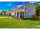 Charming two-story home with a well-manicured lawn and a two-car garage at 513 Buttercup Way, Fort Mill, SC 29715