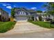 Traditional two-story home featuring a lush front lawn, attached garage, and covered front porch at 513 Buttercup Way, Fort Mill, SC 29715