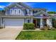 Charming two-story home with a well-manicured lawn, two-car garage, and inviting red door at 513 Buttercup Way, Fort Mill, SC 29715