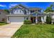 Charming home with manicured lawn, a two-car garage, and a welcoming red front door at 513 Buttercup Way, Fort Mill, SC 29715
