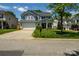 Traditional two-story home featuring a lush front lawn, attached garage, and covered front porch at 513 Buttercup Way, Fort Mill, SC 29715