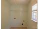 Bright laundry room with tile floors, washer hookups, and a window for natural light at 513 Buttercup Way, Fort Mill, SC 29715