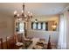 An open-concept living and dining room area with lots of natural light at 513 Buttercup Way, Fort Mill, SC 29715