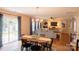 Bright living room featuring a dining table and chairs, a comfortable sofa, and stylish decor at 513 Buttercup Way, Fort Mill, SC 29715
