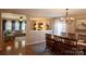 An open-concept dining and living room area featuring an open design and plenty of natural light at 513 Buttercup Way, Fort Mill, SC 29715