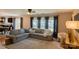 Spacious living room featuring a large sofa, neutral decor, and lots of light at 513 Buttercup Way, Fort Mill, SC 29715