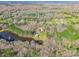 An aerial view shows the home's prime location nestled among lush greenery and serene bodies of water at 529 Langley Rd, Lancaster, SC 29720