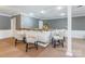 Basement bar with light colored walls, wooden bar counter, and four chairs at 529 Langley Rd, Lancaster, SC 29720