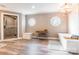 Bright bathroom featuring a chandelier, freestanding tub, tiled shower and windows at 529 Langley Rd, Lancaster, SC 29720