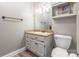 Bathroom with updated vanity, new hardware, framed mirror, and lighting at 529 Langley Rd, Lancaster, SC 29720